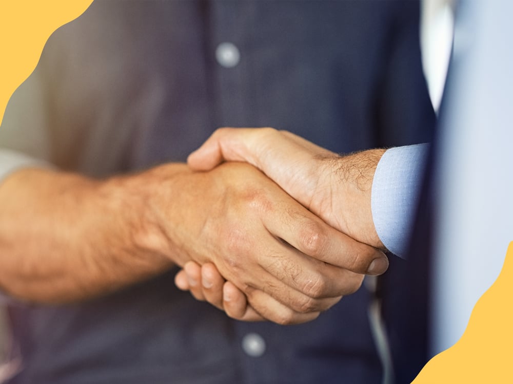 Client and businessperson shaking hands